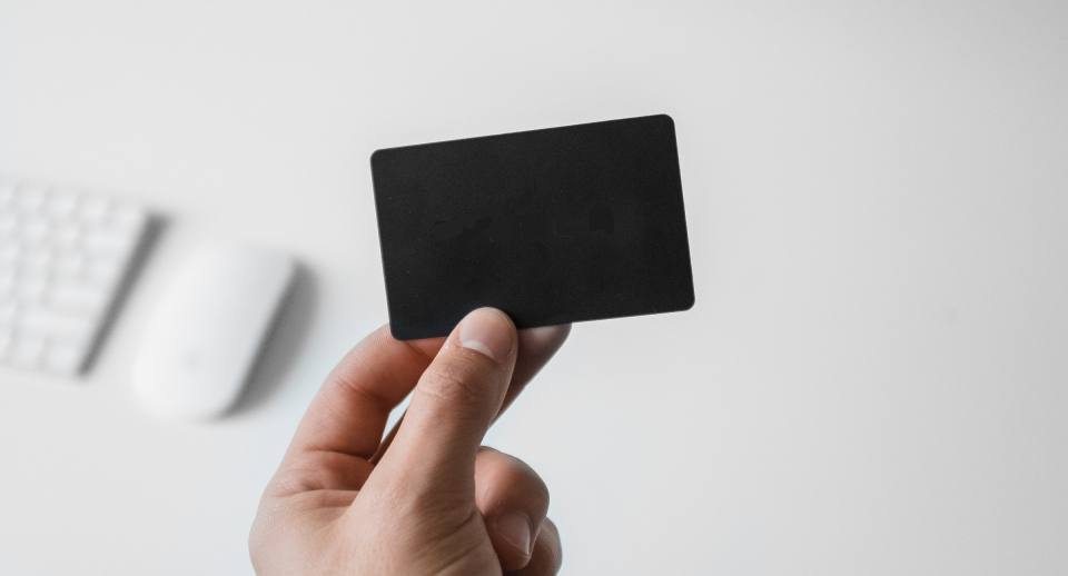 A photo of a hand holding a blank card