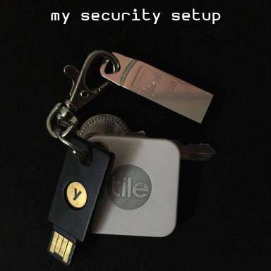 Header Image of my keychain, with a Tile, Yubikey, USB Disk, and house keys